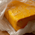 how long can cheddar cheese go unrefrigerated